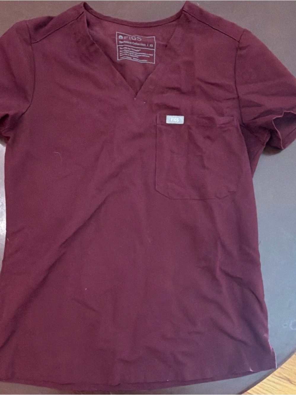 FIGS Women’s Short Sleeve V-Neck Scrub Top in Burgundy
